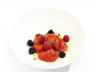 Dumplings with cherry, seasonal berry and creamy vanilla sauce.