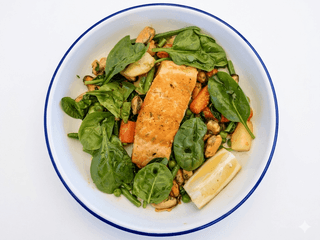Grilled salmon fillet with vegetable sauté and mussel meat 