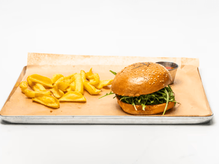 Burger with tiger shrimps, arugula and basil  sauce
