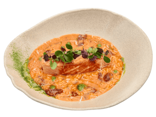 Grilled salmon, served over pomodoro risotto