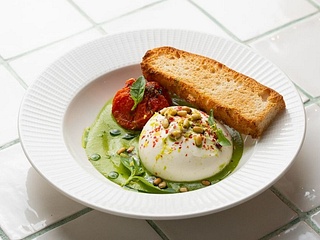 DELICATE BURRATA WITH PESTO CREAM AND ROASTED TOMATOES