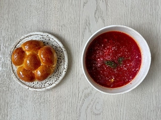 Kyiv borsch with porcini mushrooms served with pampushka