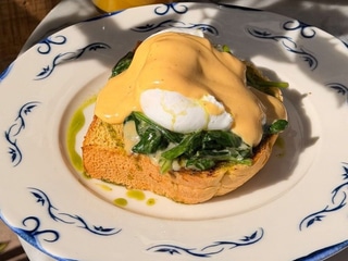 Eggs Benedict with hollandaise sauce and spinach