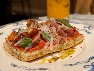 Focaccia with prosciutto San Daniele and tomato souse