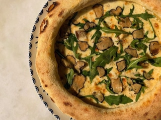 Pizza "Tartufo" with porcini mushrooms and black truffle