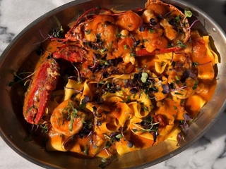 Pappardelle with half bogavante lobster in crab sauce