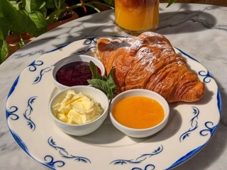 Croissant with jam and butter