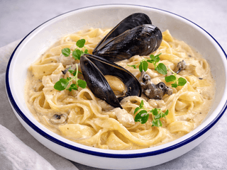 Паста з морепродуктами в вершковому соусі