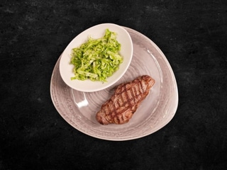New York Steak. Served with a fresh young cabbage and dill salad.