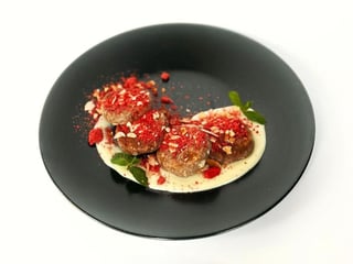 Chocolate syrnyky with custard and almond crumbs