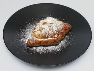 Croissant with frangipane cream and almond flakes