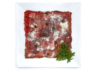 Carpaccio di Vitello with tomatoes concasse,capers and Parmesan