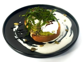 Guacamole toast with poached egg