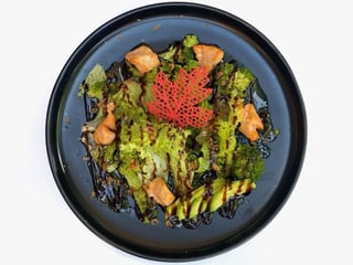Salad with baked salmon and avocado