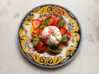 Burrata with tomatoes, strawberries and basil