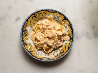 Mafaldine with seafood in a creamy sauce