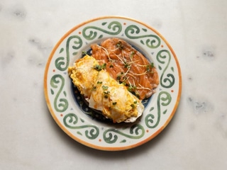 Toast with salmon, creamy scramble eggs and pecorino cheese