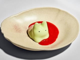 Matcha Panna Kitty with strawberry coulis 