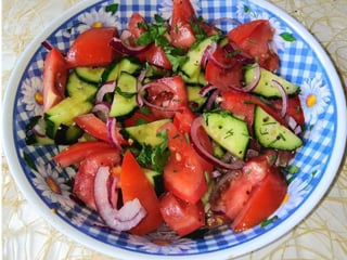 Homemade salad (tomatoes, cucumbers and peppers)