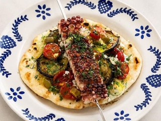 Grilled octopus, flatbread, roasted vegetables